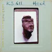 Detail of terracotta figurine head.