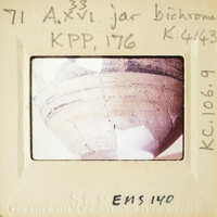 Old cracked pottery with visible layers and textures.