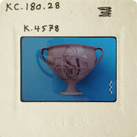 Ancient Greek vase with intricate designs on blue background.