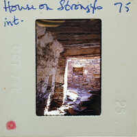 Picture of a cave with sunlight streaming through an opening, on a film strip.