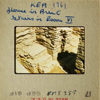 Old photograph of ruins with stone walls and foundations, possibly from an ancient city.