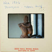 Ancient sculpture on display, possibly from an archaeological site.