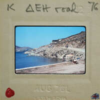 Picture of a beach with ocean and mountains, dated August 1976.