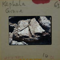 Rocky cliff with jagged edges and a rugged texture.