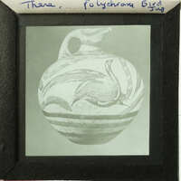 A black and white photograph of an ancient Greek vase with sea creatures depicted on its side.