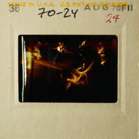 This is an old photograph depicting a black and white scene, possibly related to a specific event or subject matter, as indicated by the visible text on the slide.