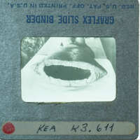 Bottom of terracotta figurine showing round skirt base.