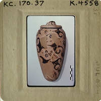 Ancient vase with intricate designs on display.