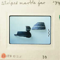 Ancient pottery displayed on a white background.