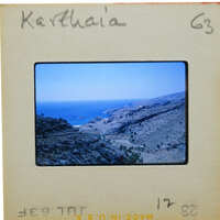 A slide of a coastal landscape with mountains and the sea, labeled "Katharina" on its border.