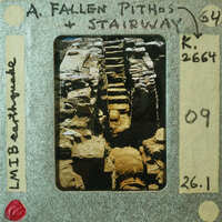 A photograph of a fallen staircase with annotations on the film strip.