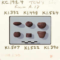 Photograph of rocks with labels and measurements, possibly from an educational setting.