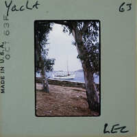 A vintage photo of a boat on the water with trees and a stone wall, labeled "Yacht" and "Lee".