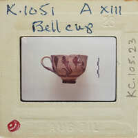 Ceramic mug with a handle (K.1051), in profile on a white surface.