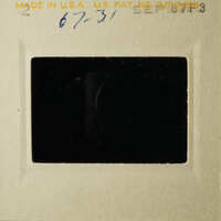 The photograph shows an old, black and white photo within a frame.