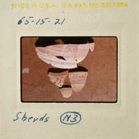 Photograph of ancient pottery shards on display.