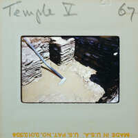 Excavated wall with flooded interior.