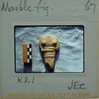 Headless marble figurine from the front.