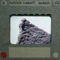 Image of a film clapperboard with the name "Mark Cooper" and a picture of an old, rusted object on it.