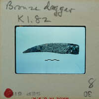 Small metal fragment of what looks to be a small knife, K1.82.