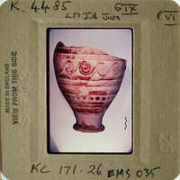 Ancient Greek vase with red-figure technique and intricate designs.