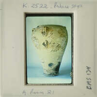 Ancient vase with intricate designs on display.