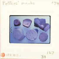 Six fragments of pottery with incised marking on them.