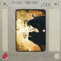 Old photograph of a coastal landscape with buildings and waterways.