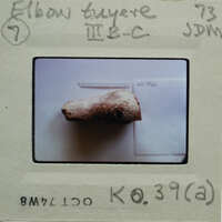 Stone fragment on table.