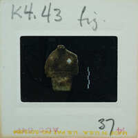 Torso of marble figurine from front.