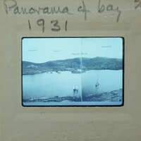 Black and white photograph of a harbor with boats, labeled "PANORAMA OF BAY" from 1931.