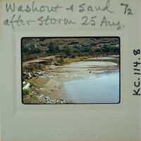A photograph of a dried-up riverbed with sand and rocks, labeled "Washed Out & Sanded 25 Aug".