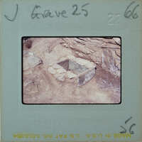 Black and white photograph of a stone structure on a film strip.