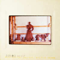 This is a photograph of a pottery studio with various clay sculptures on display.