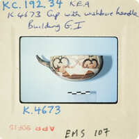 Ancient ceramic bowl with intricate designs on display.