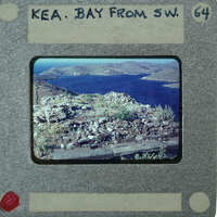 Picture of a landscape with water and mountains, taken from an elevated viewpoint.