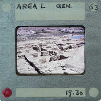 The image is a photograph of an old, dilapidated building or ruins with a vintage film strip border and label indicating it as "Area L Gen."