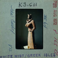 Detail of almost complete terracotta figurine from the side minus right arm.