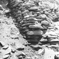 A blurred and faded photograph with handwritten text on it.