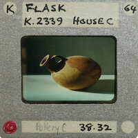 Reassembled pot (K.2339) on it's side resembling a flask.