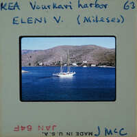 Photo of a boat on the water with mountains in the background, marked as "Eleni V" and showing miles traveled.