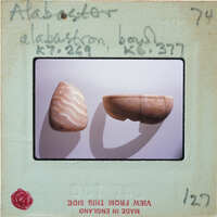 Two broken vessels, tall with wavy patterns on left, short bowl on right, K7.269, K6.377