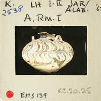 Ancient Greek vase with intricate patterns and designs, photographed on a white background.