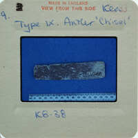 Rectangular object on blue surface.