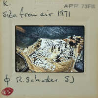 Aerial photograph of a historical site with handwritten notes on the frame.