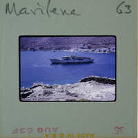 A vintage photograph of a boat on the water with a rocky coastline, labeled "MARLENE" and marked as "6G3".