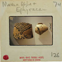 Two pieces of broken ceramic from different vessels showing variation in decorations.