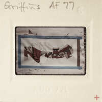 Old photograph with a torn corner and visible film strip.