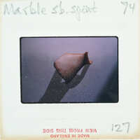 Fragment of stone vase showing spout.