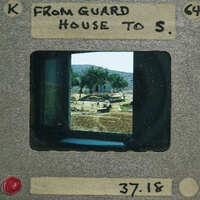 A vintage film strip with a picture of an old guard house on it.